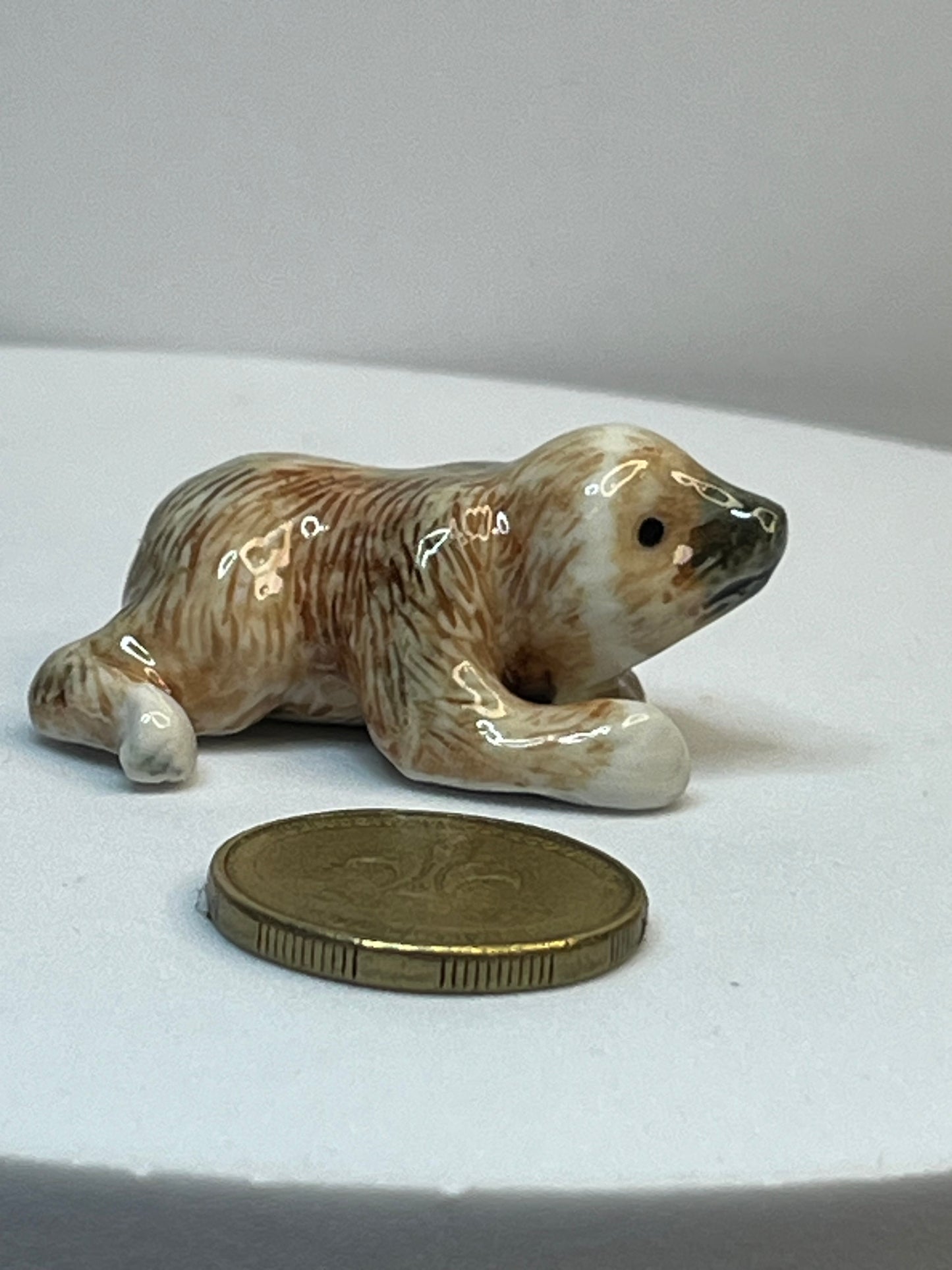 Miniature Porcelain Sloth Figurine Lying Down