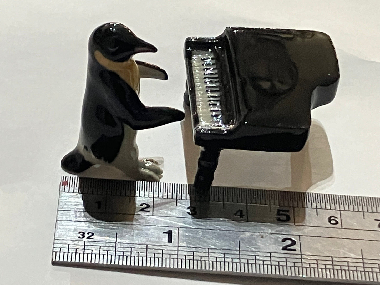 Miniature Porcelain Penguin Playing Piano