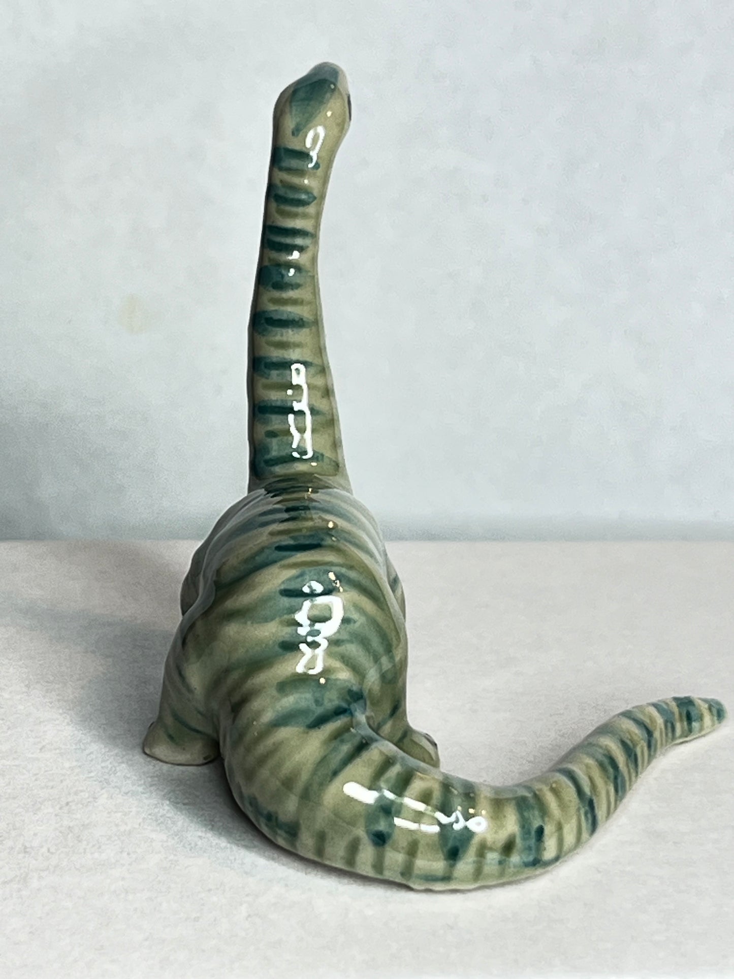 Miniature Porcelain Hand Painted Figurine Diplodocus Dinosaur - Looking Up Pose