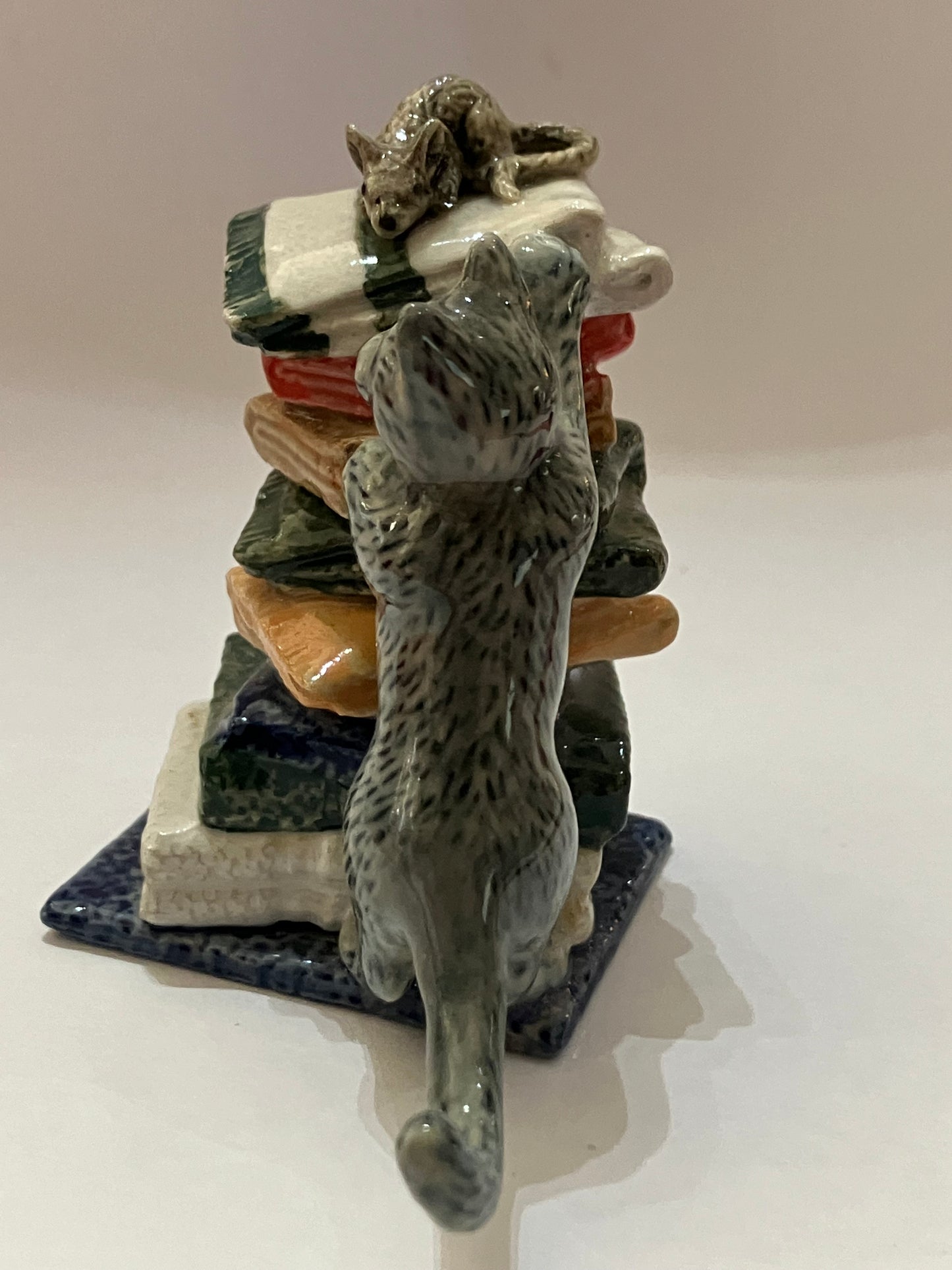 Miniature Porcelain Grey Cat Chasing Mouse On Towels
