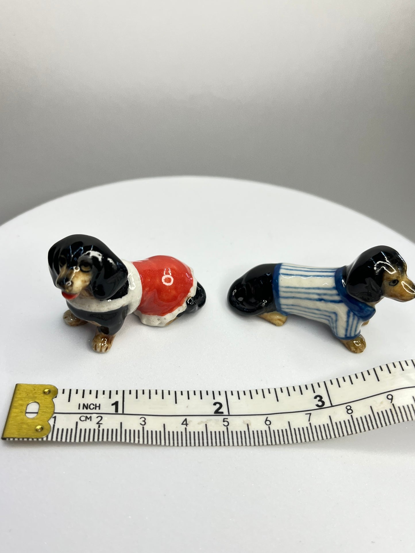 Miniature Porcelain Black Dachshund with Clothes Set of 4 Figurines