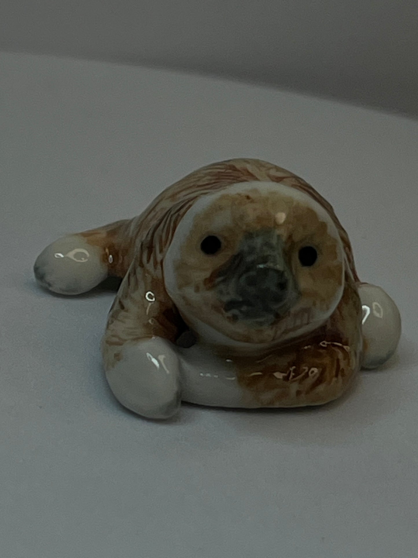 Miniature Porcelain Sloth Figurine Lying Down