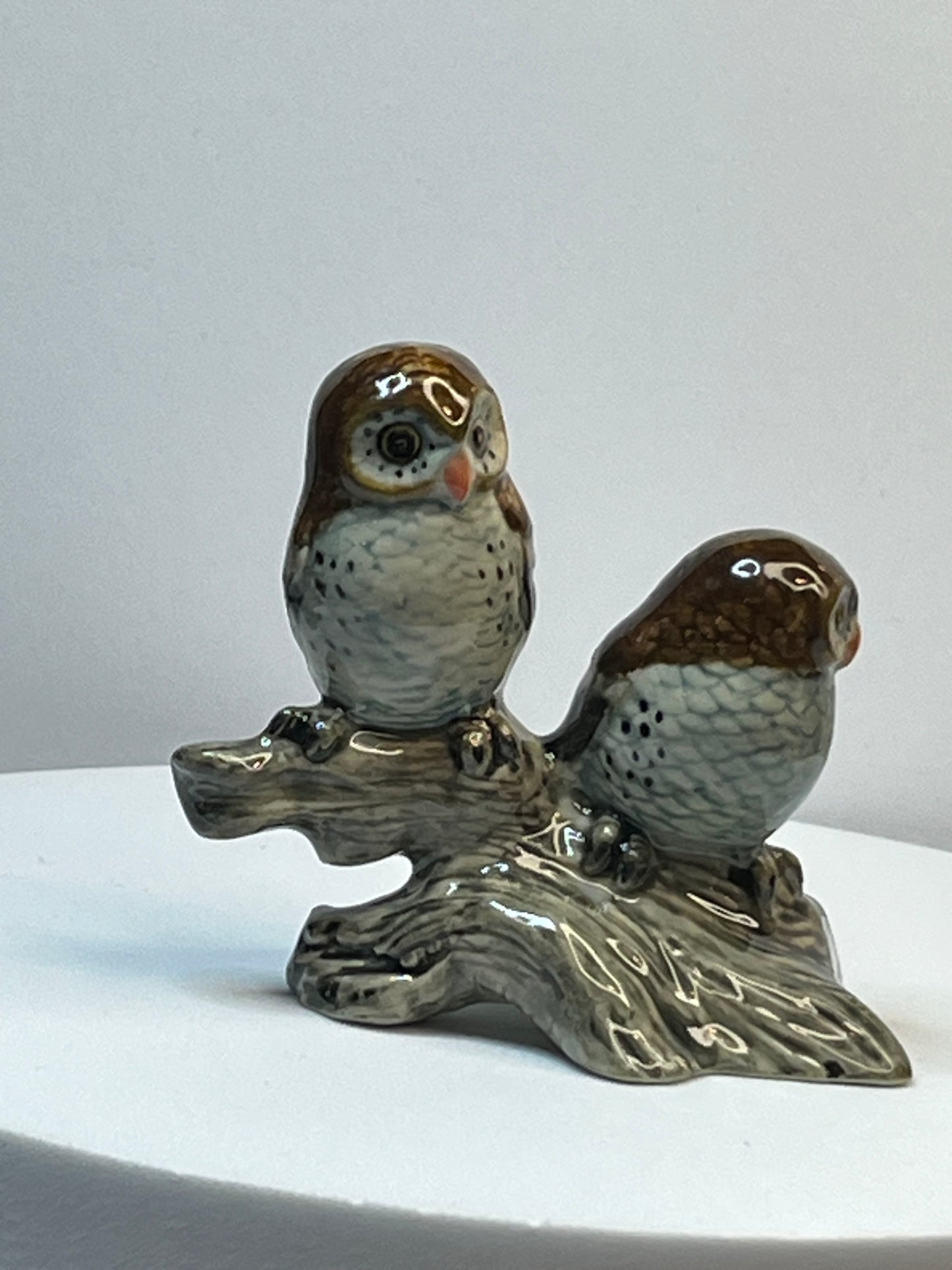 Miniature Porcelain Two Brown and Blue Owls on Log Figurine