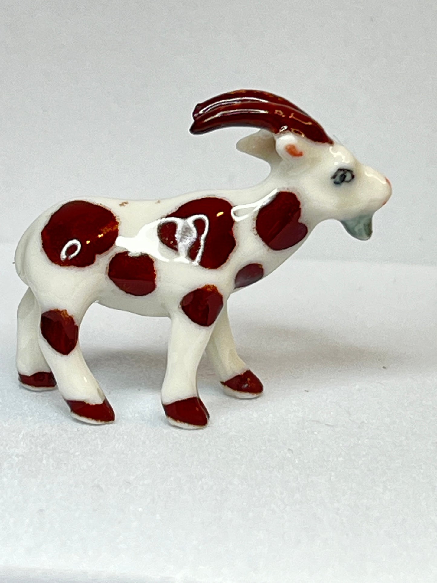 Miniature Porcelain Brown and White Goat Figurine