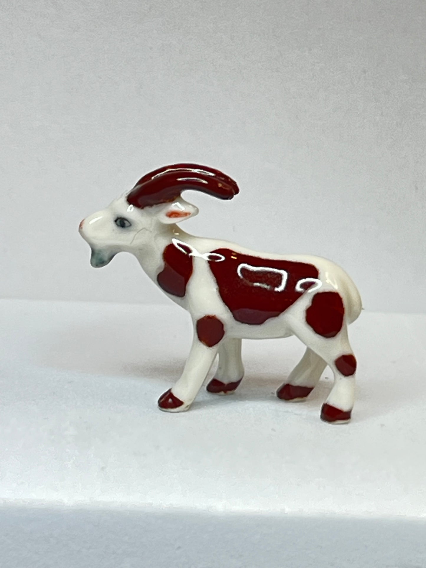 Miniature Porcelain Brown and White Goat Figurine