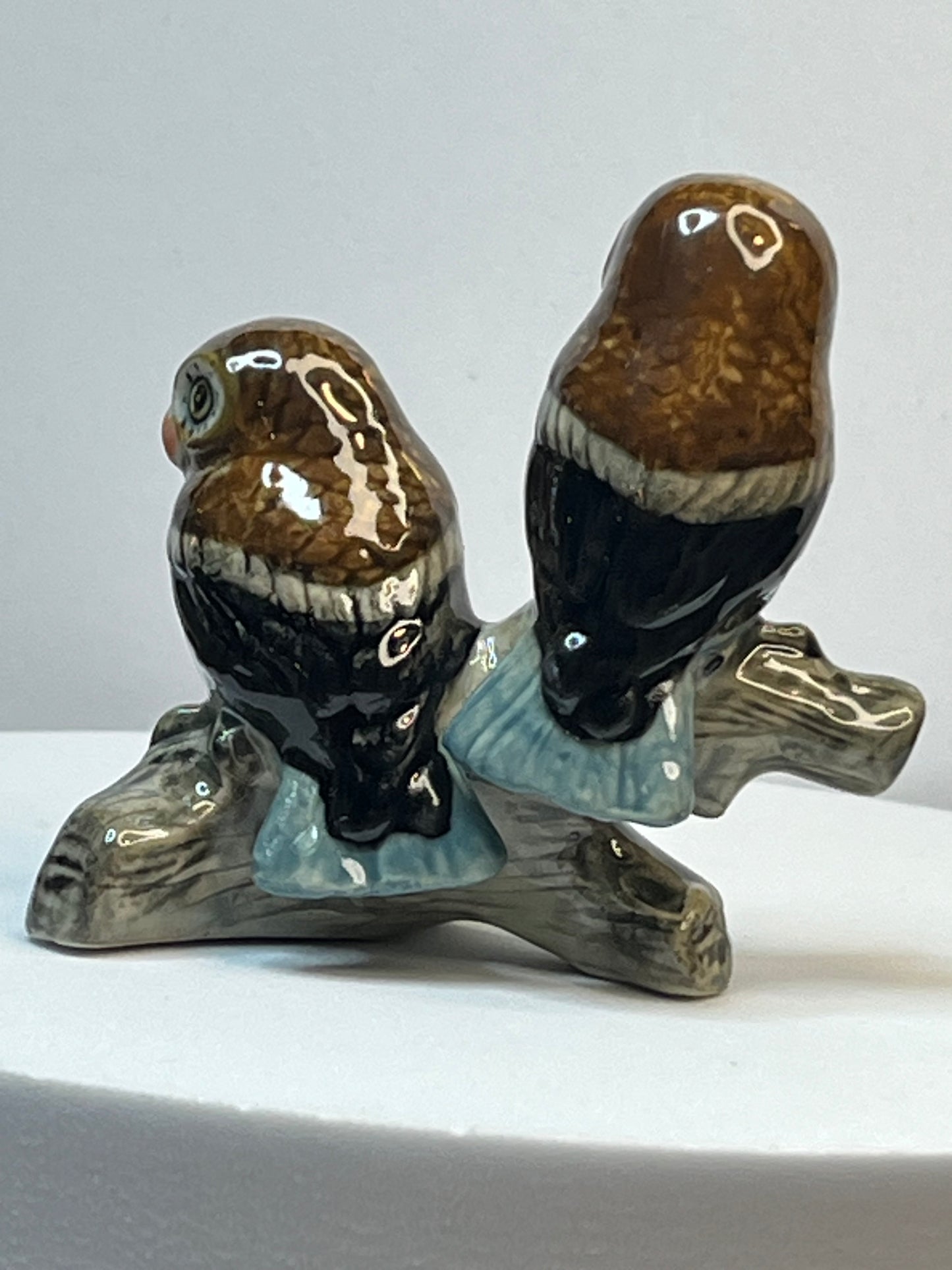 Miniature Porcelain Two Brown and Blue Owls on Log Figurine
