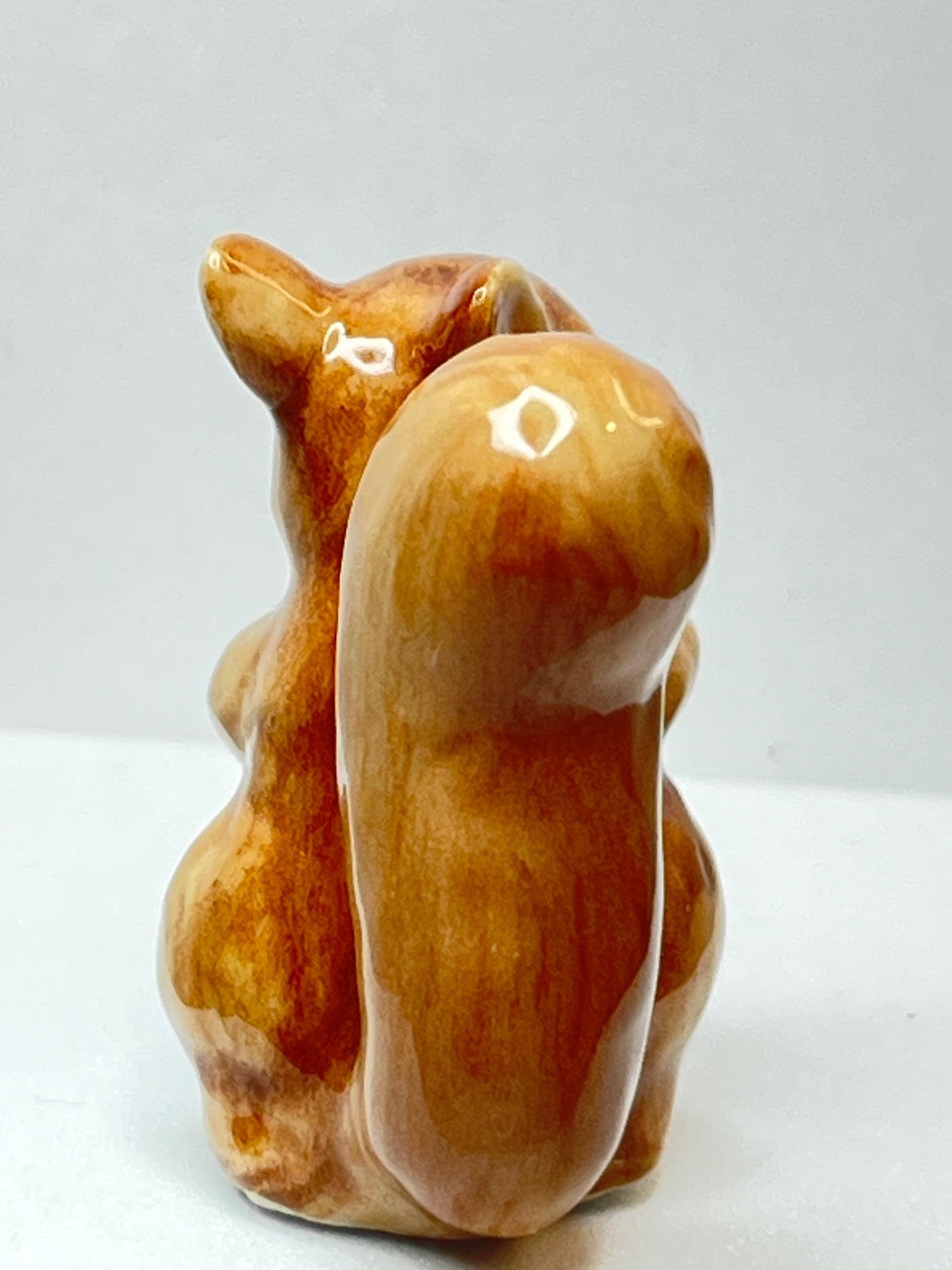 Miniature Porcelain Squirrel Eating Pine Cone Nut Figurine