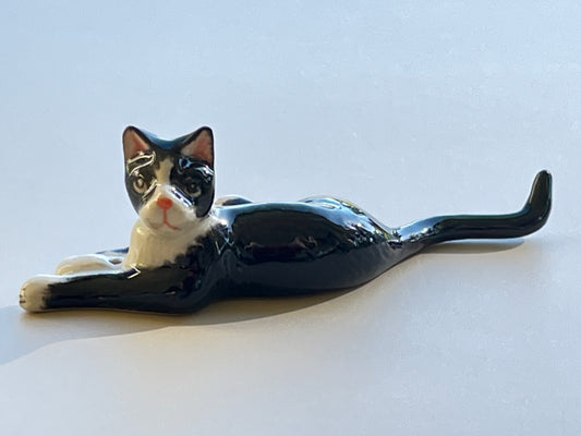 Miniature Porcelain Tuxedo Cat Lying Down