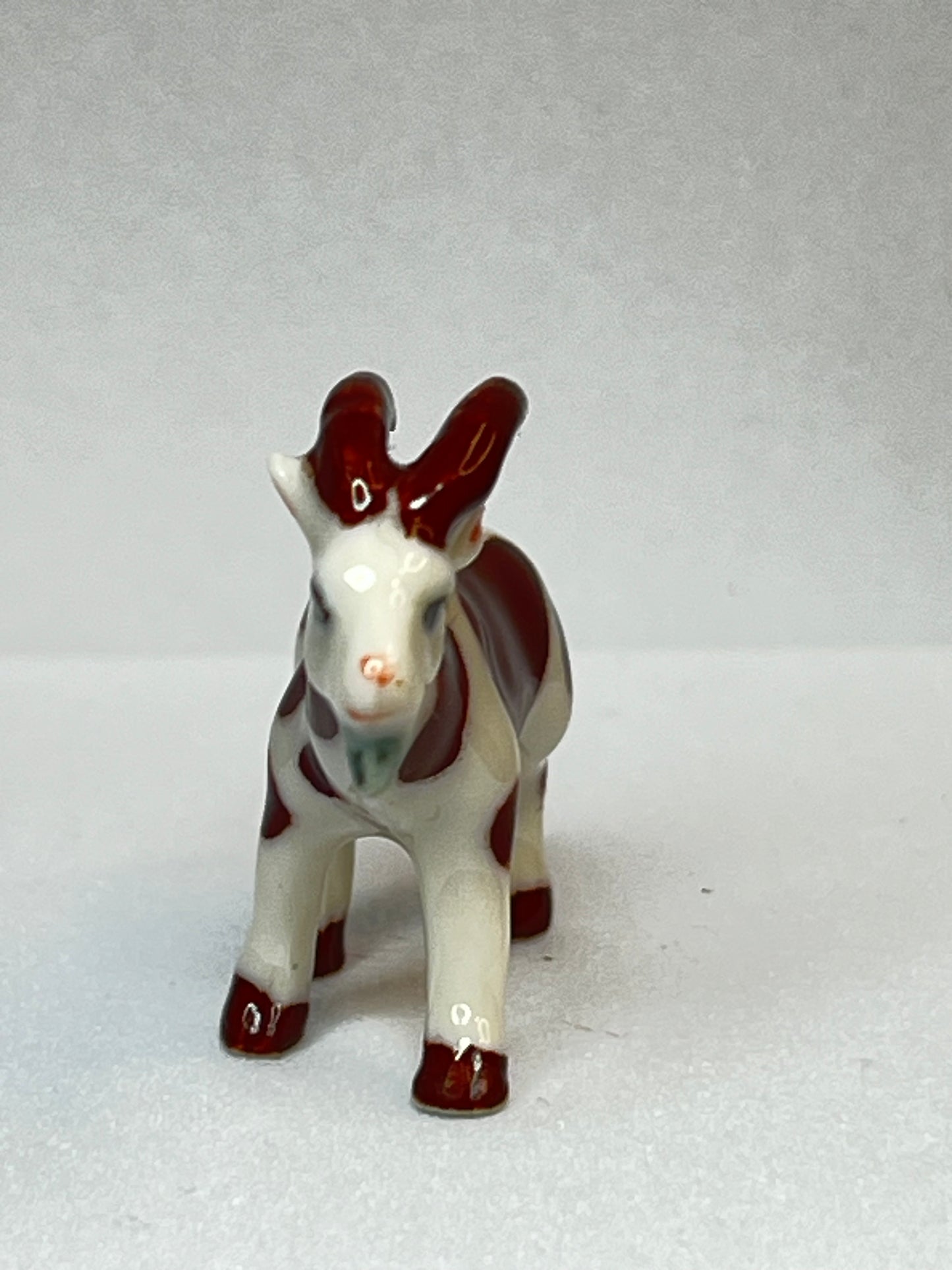 Miniature Porcelain Brown and White Goat Figurine