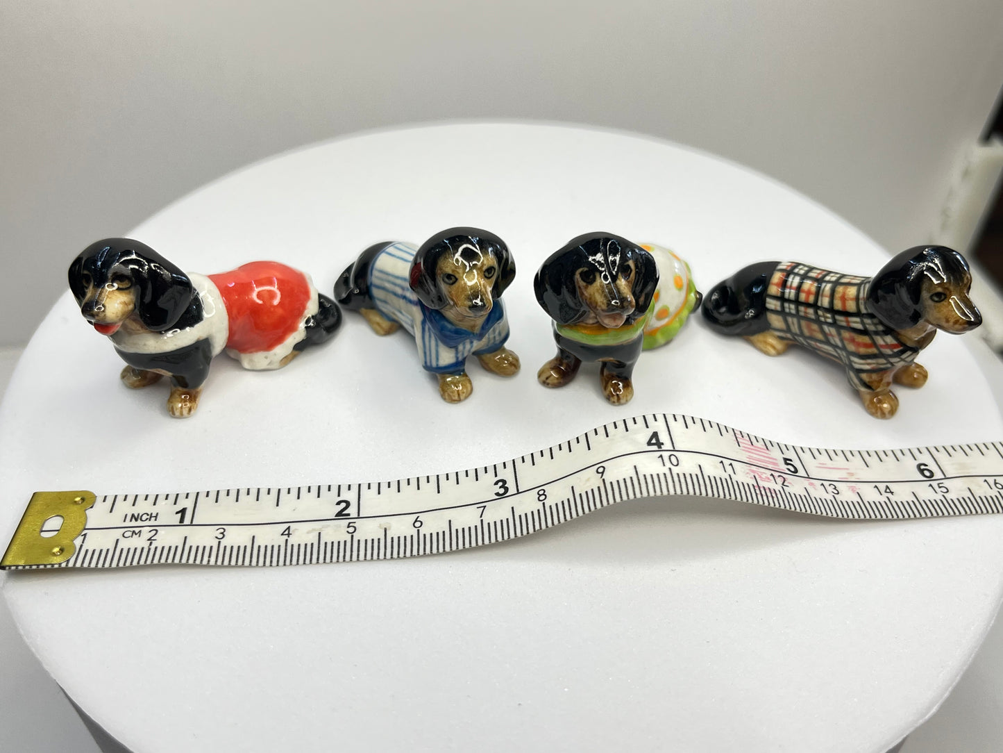 Miniature Porcelain Black Dachshund with Clothes Set of 4 Figurines