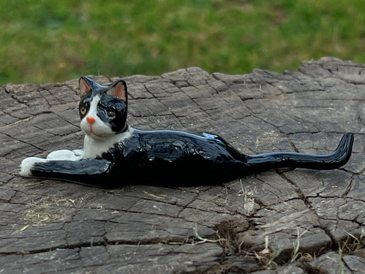 Miniature Porcelain Tuxedo Cat Lying Down