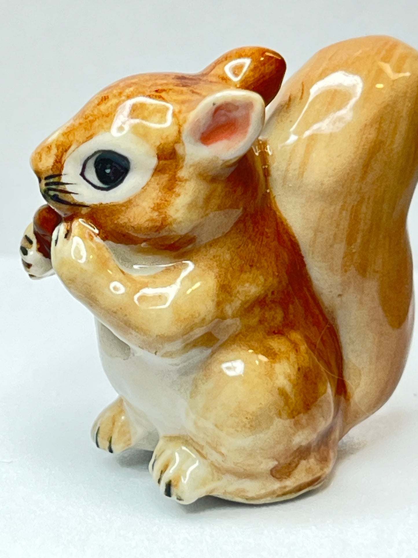 Miniature Porcelain Squirrel Eating Pine Cone Nut Figurine