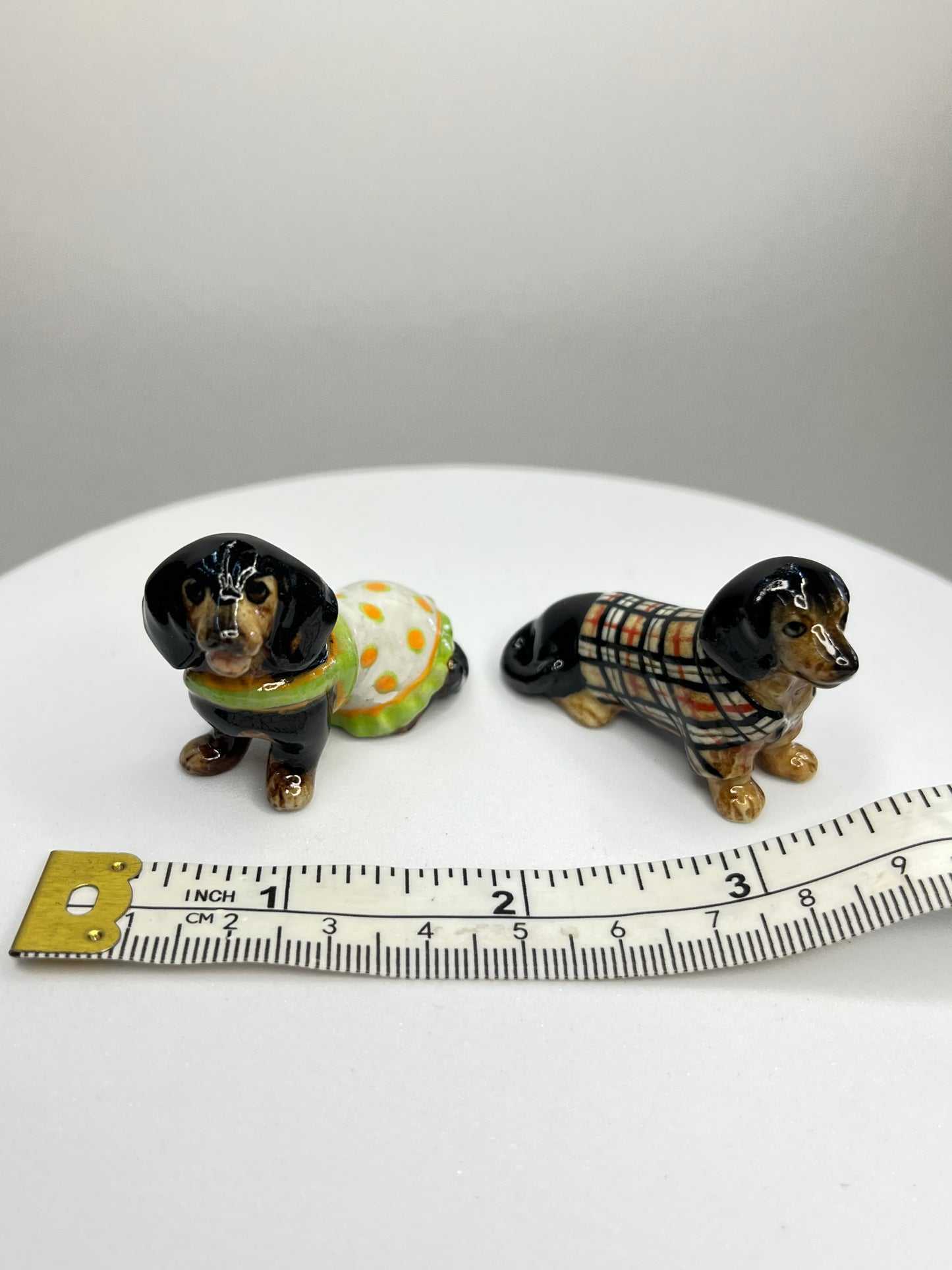 Miniature Porcelain Black Dachshund with Clothes Set of 4 Figurines