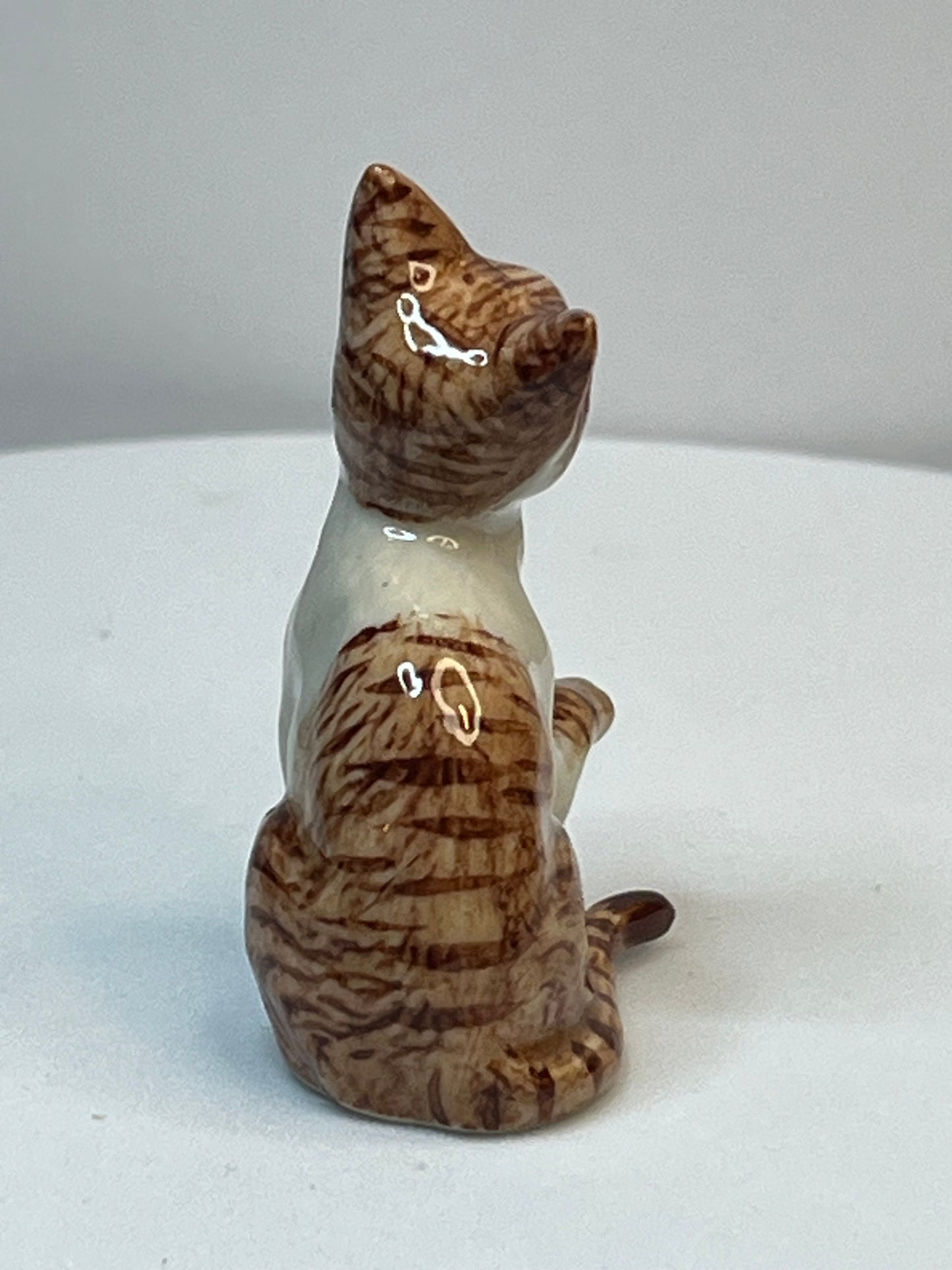 Miniature Porcelain Ginger and White Cat Kitten Figurine With Foot Up