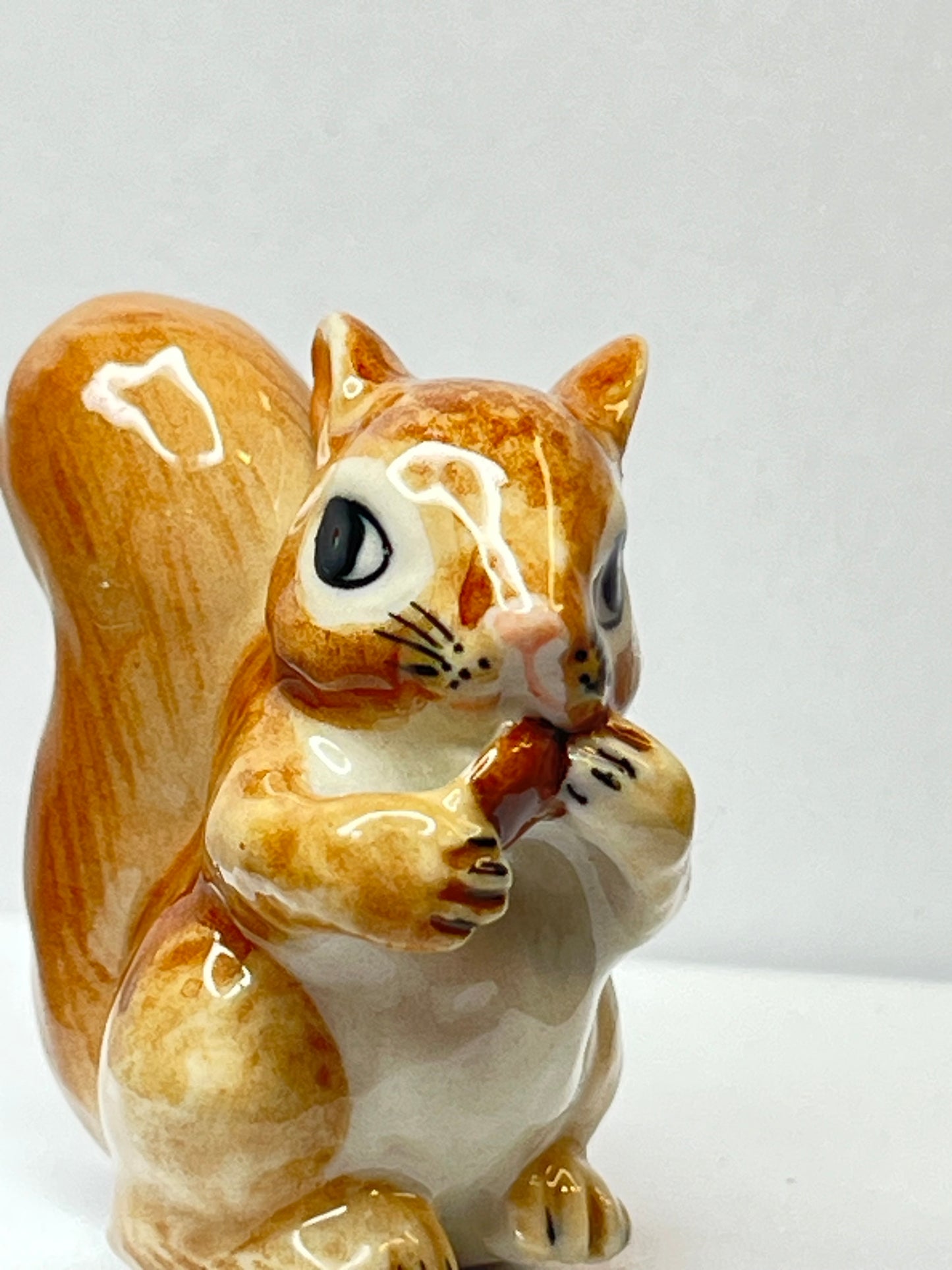 Miniature Porcelain Squirrel Eating Pine Cone Nut Figurine