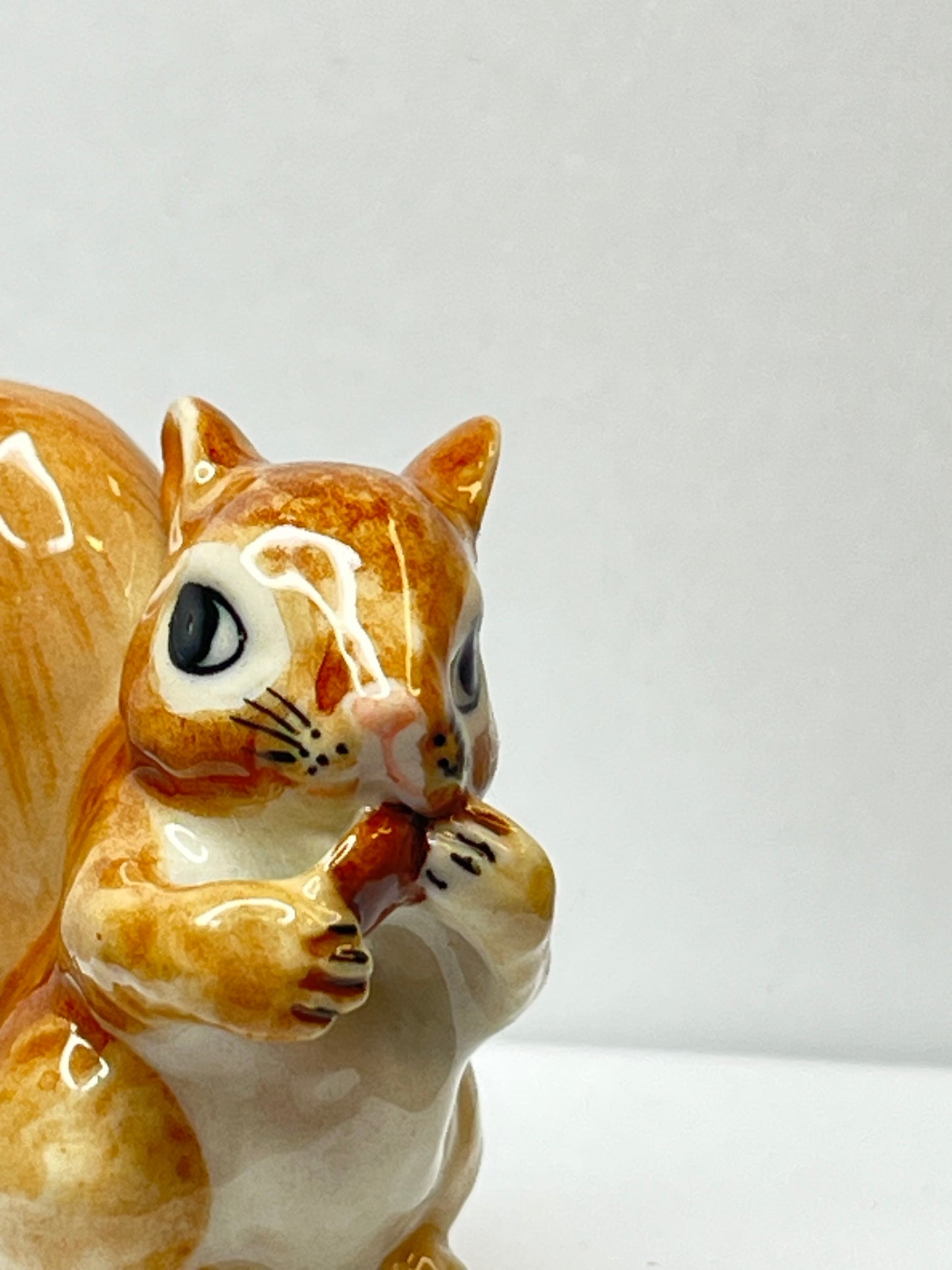 Miniature Porcelain Squirrel Eating Pine Cone Nut Figurine