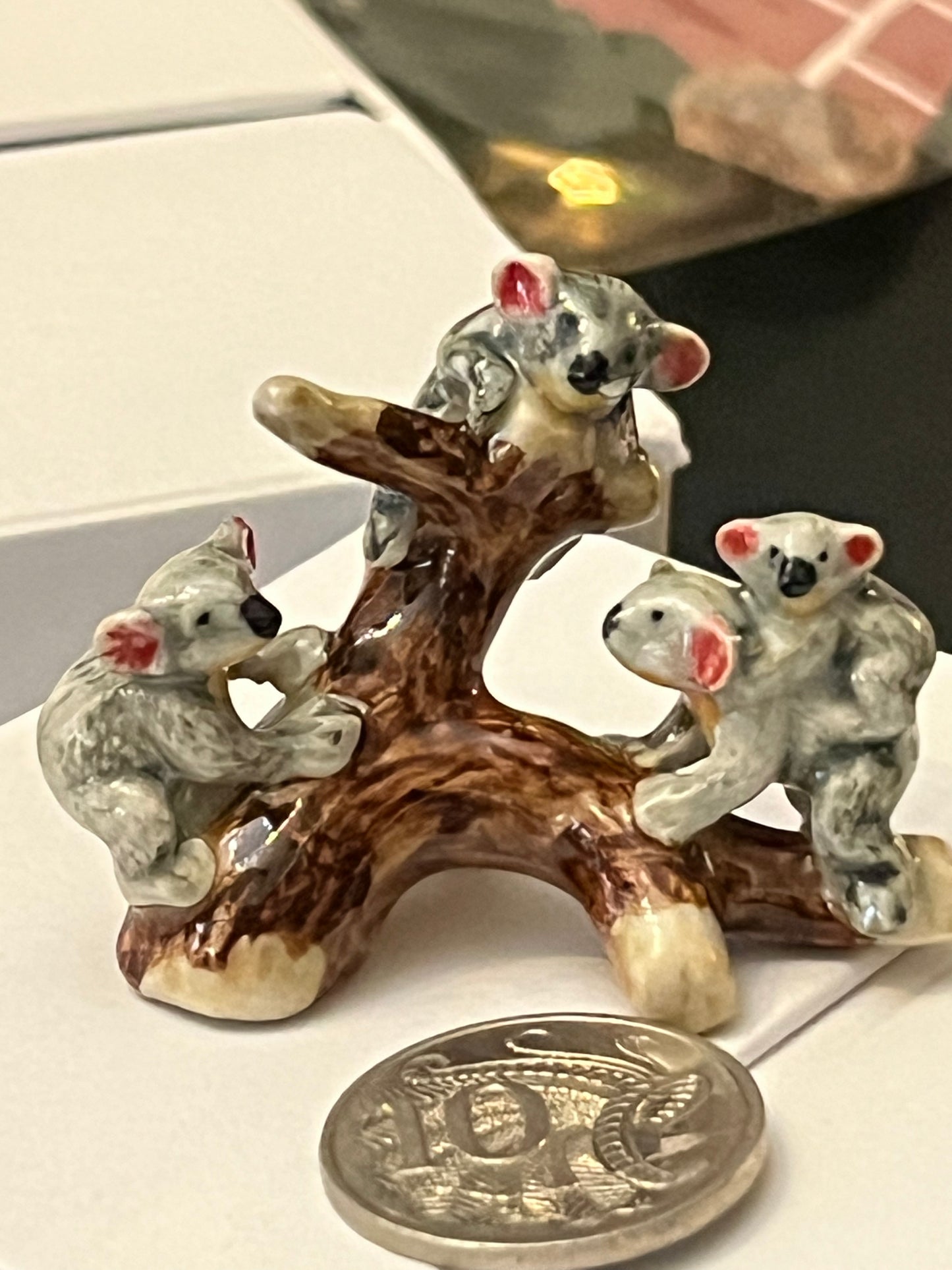 Miniature Porcelain Koalas on Tree Branch