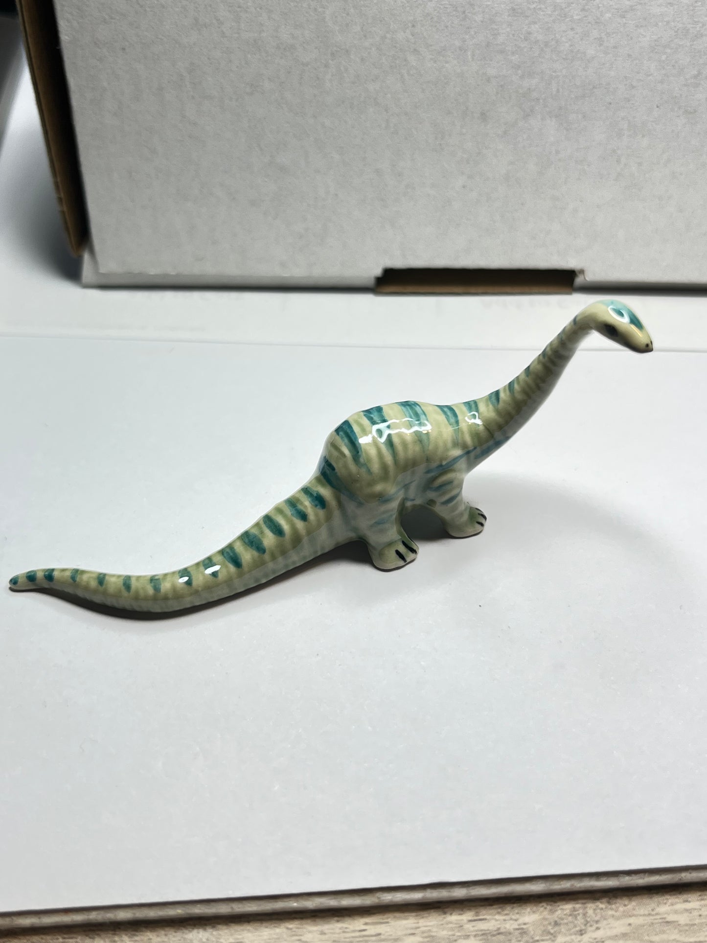Miniature Porcelain Diplodocus Dinosaur Figurine