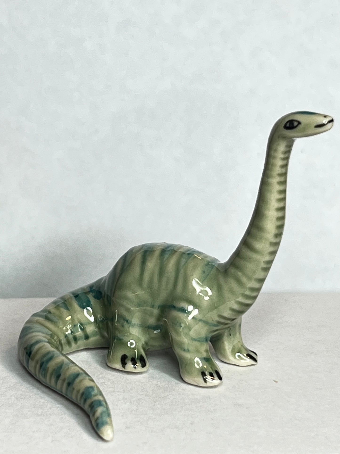 Miniature Porcelain Hand Painted Figurine Diplodocus Dinosaur - Looking Up Pose