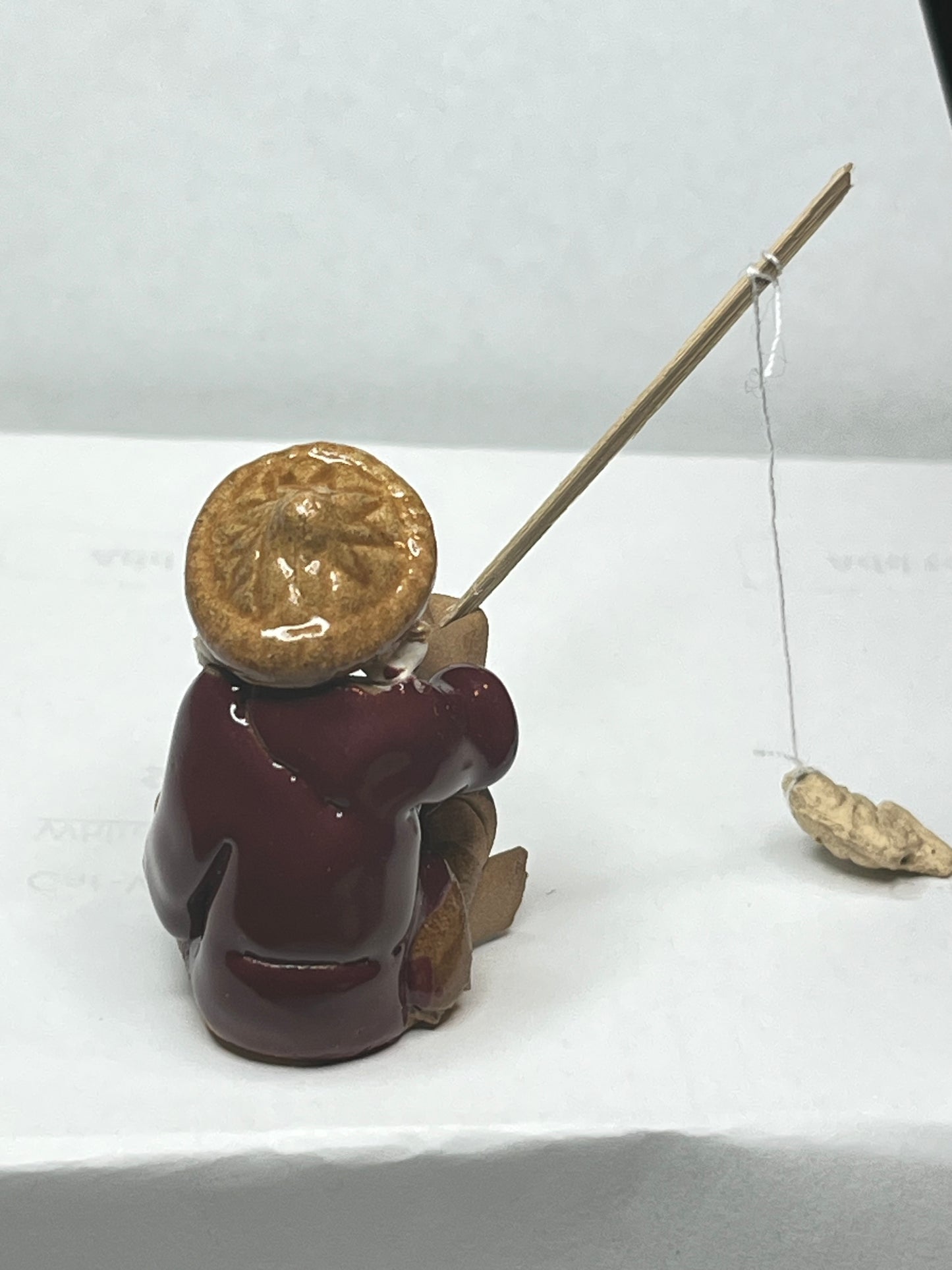 Miniature Handcrafted Fishing Man with Hanging Fish Figurine