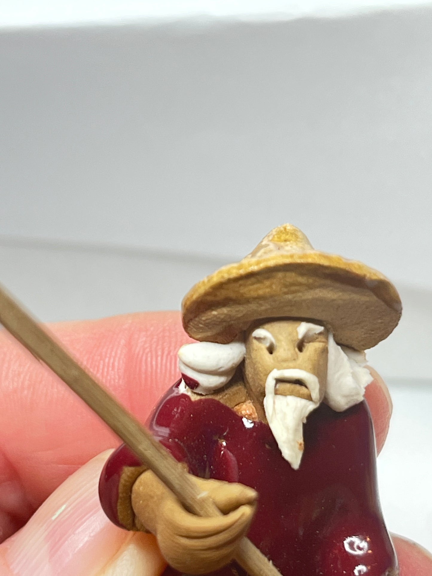 Miniature Handcrafted Fishing Man with Hanging Fish Figurine