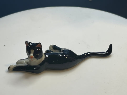 Miniature Porcelain Tuxedo Cat Lying Down